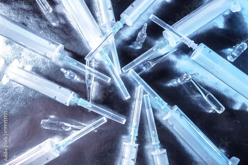 Syringes lie on a metal tab...
