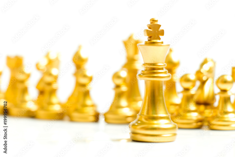 Gold king chess piece stand in front of team on white background (Concept for leadership, management) Gold king chess piece stand in front of team on white background (Concept for leadership, management)