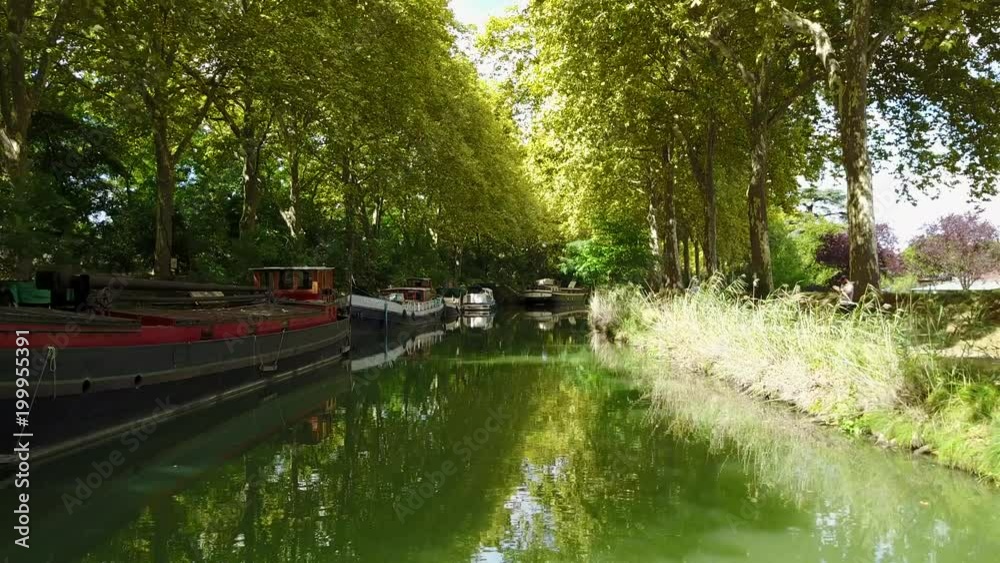 Barge on a river. Péniches sur le canal du midi. Toulouse France