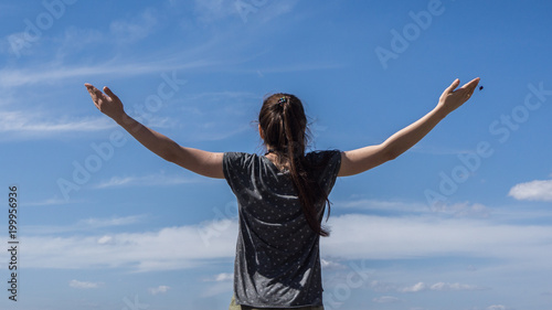 Girl raising hands