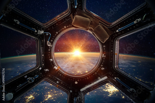 Earth and galaxy in spaceship international space station window porthole. Elements of this image furnished by NASA