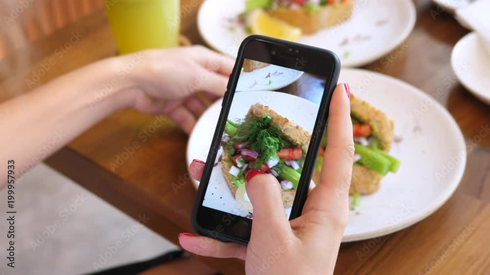 Female Hands Photographing Food By Smartphone Female Hands Photographing Food By Smartphone