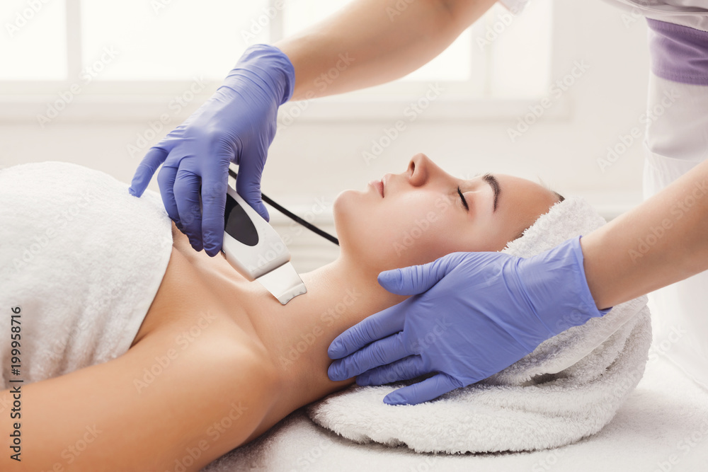 Woman getting facial treatment at beauty salon Woman getting facial treatment at beauty salon