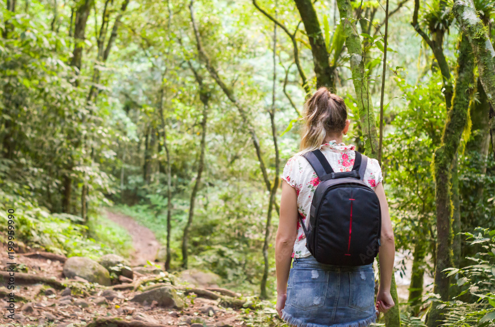 Great concept of trail, back view of young woman walking. Great concept of trail, back view of young woman walking.