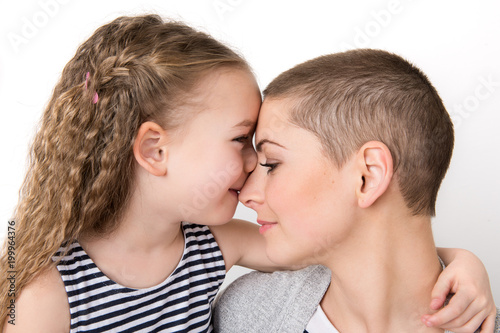 Принти на полотні Cute preschool age girl with her mother, young cancer patient in remission
