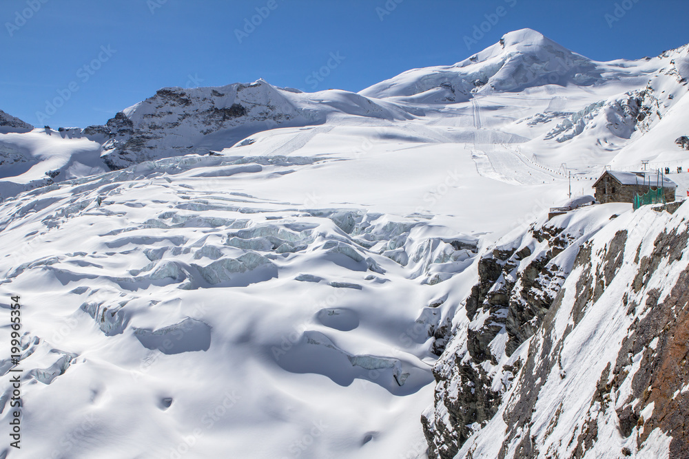 Fototapeta premium Snow-covered glacier in a Mountains of Saas-Fee in Switzerland