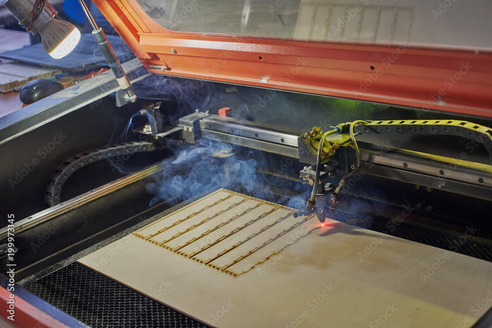 Laser programmable machine cutting of plywood shapes for the box Laser programmable machine cutting of plywood shapes for the box