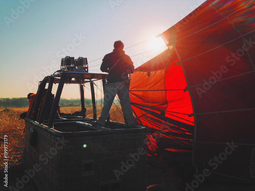 Filling with hot air of red balloons	 photo