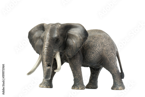 Figurine of a elephant on a white background. Toy. Side view