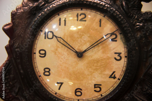 Face of old metallic clocks