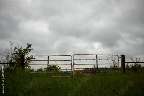 Stormy grey clouds over a farm field