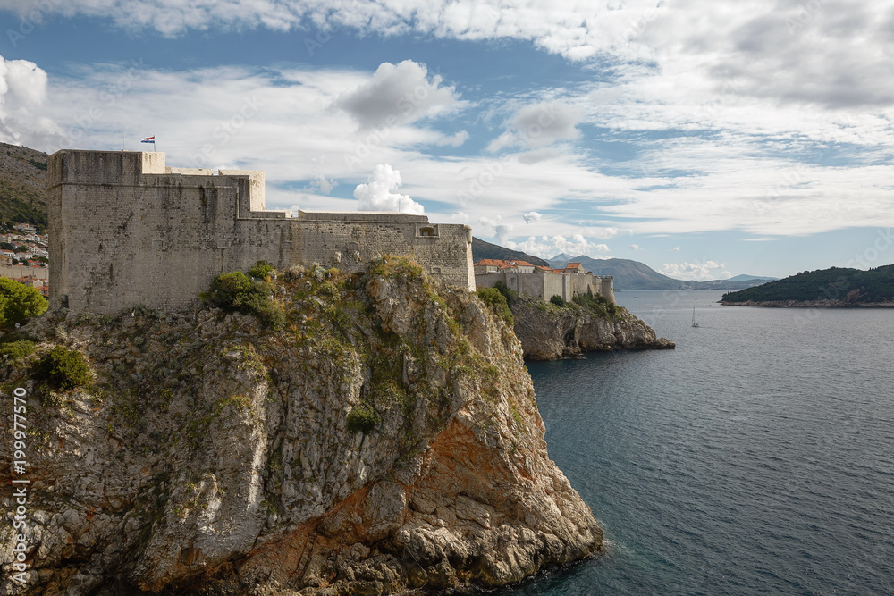 Ancient fortress on the cliff edge of Dubrovnik, Croatia protects the por
