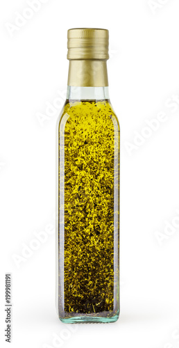 Olive oil with basil in glass bottle isolated on white backgound with clipping path
