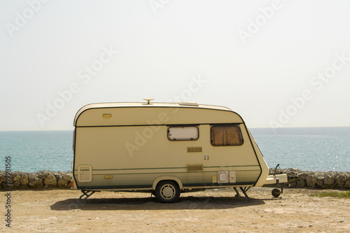 Retro caravan on the shore