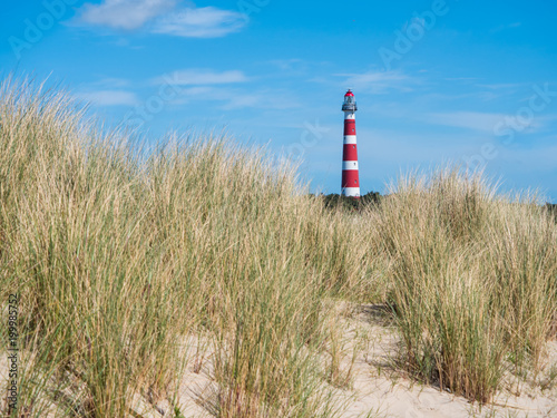 View on lighthouse in the dunes of Ameland, Holland