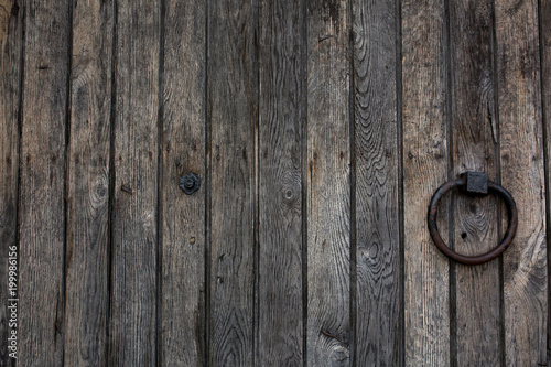 Old wooden door with metal ring handle