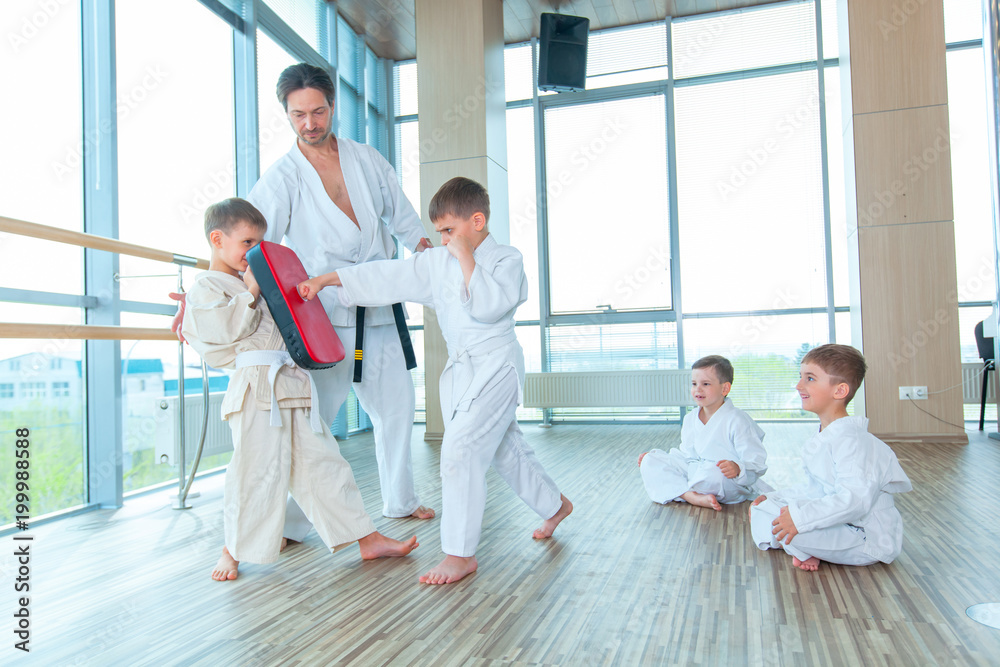 young, beautiful, successful multi ethical kids in karate position young, beautiful, successful multi ethical kids in karate position
