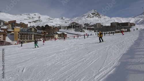 People skiing on a slope photo