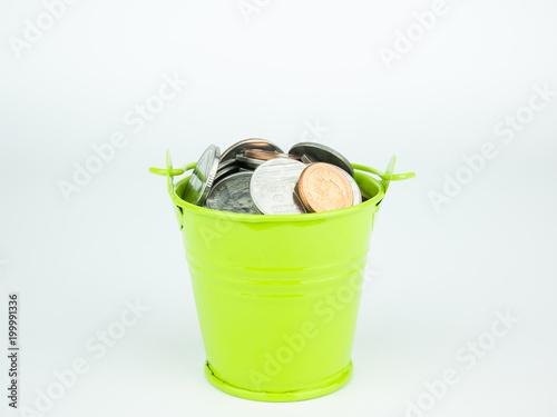 Money coins in green bucket on white background, Business concept