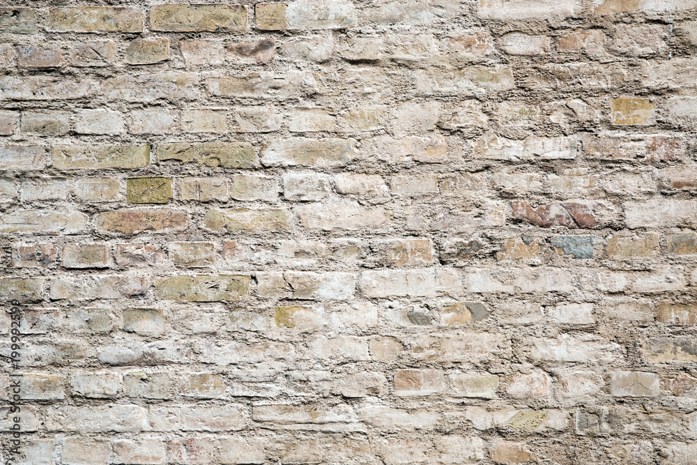 Brick wall background, grey stones texture. Construction blocks in a line Brick wall background, grey stones texture. Construction blocks in a line