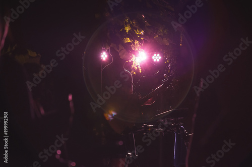 The street musician plays the guitar and sings songs at night, the island of Rьgen, Germany. photo