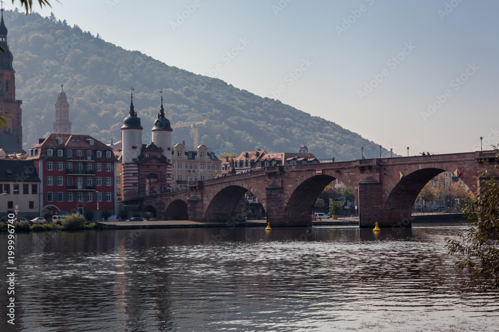 Old Bridge over river Necker with a view of old town in Heidelberg, Germany