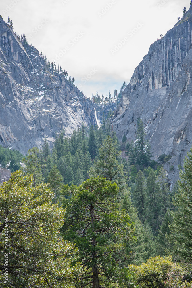 waterfalls and rivers through the mountains at yosemite 