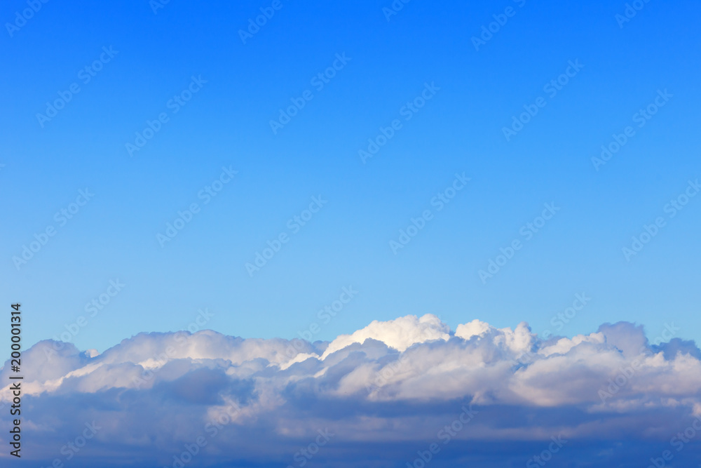 blue sky above the Cumulus clouds. Background image. blue sky above the Cumulus clouds. Background image.