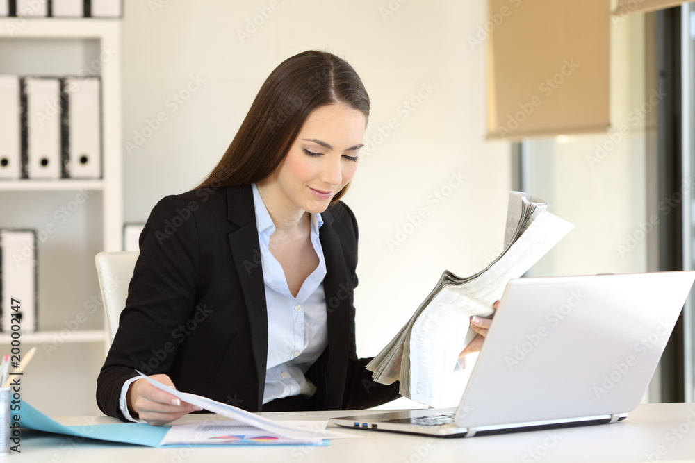 Office worker checking news and documents online Office worker checking news and documents online