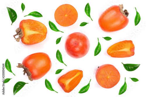 persimmon decorated with green leaves isolated on white background. Top view. Flat lay pattern