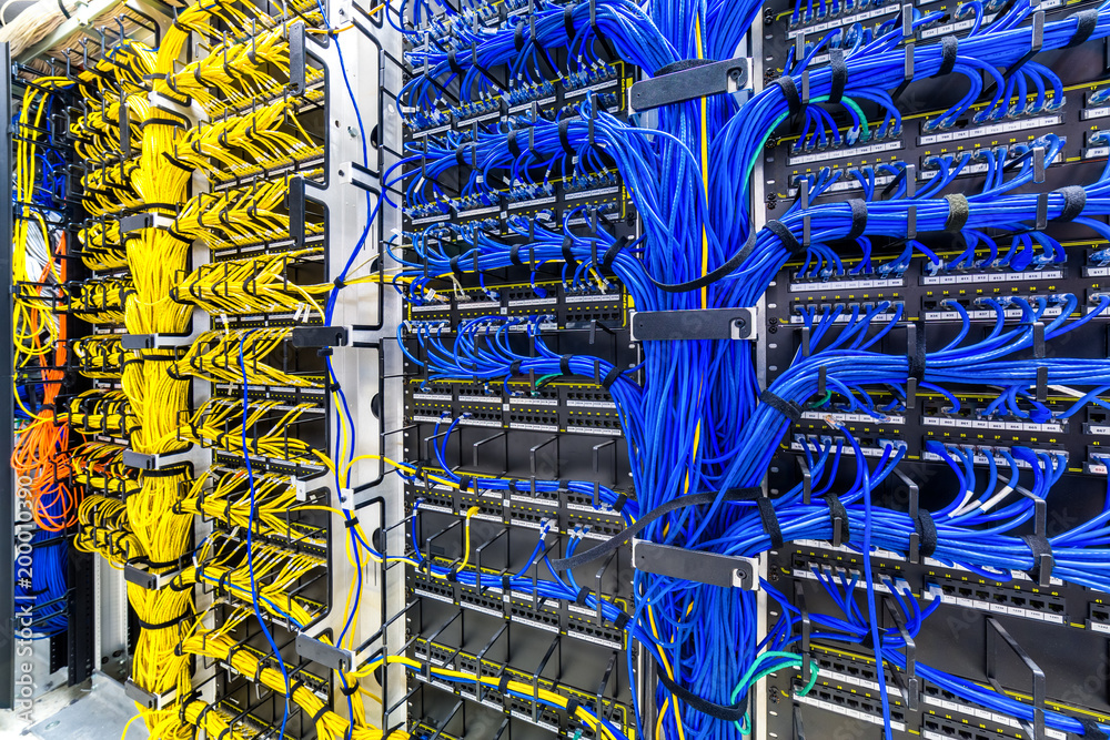 Rack with generic ethernet cat5e cables, part of a large company data center. - obrazy, fototapety, plakaty 