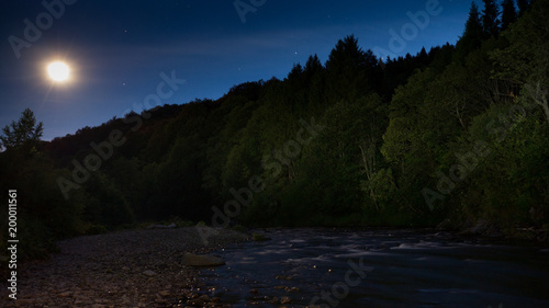 Summer mountain stream of the lunar night in the Bieszczady Mountains
