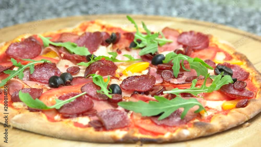 Delicious pizza close up. Meat, vegetables and arugula. Delicious pizza close up. Meat, vegetables and arugula.
