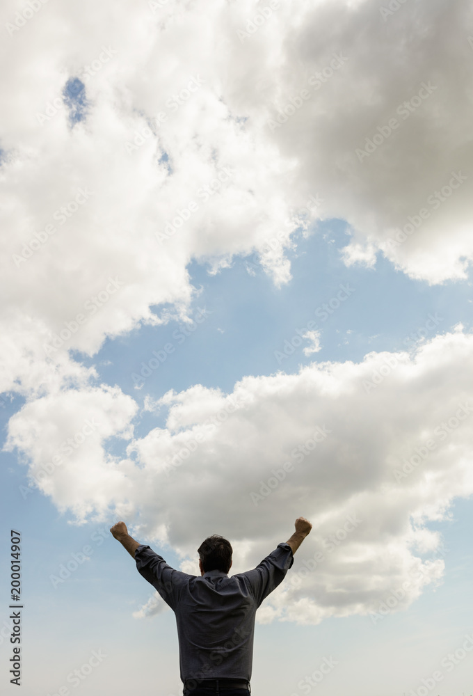 Man with arms raised against sky Man with arms raised against sky