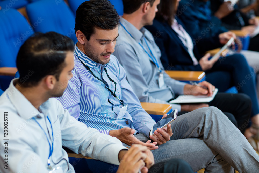 Business executives participating in a business meeting Business executives participating in a business meeting
