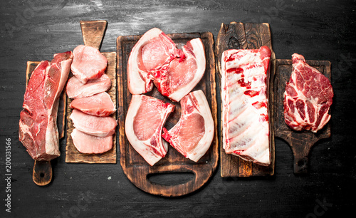 Different types of raw pork meat and beef. photo