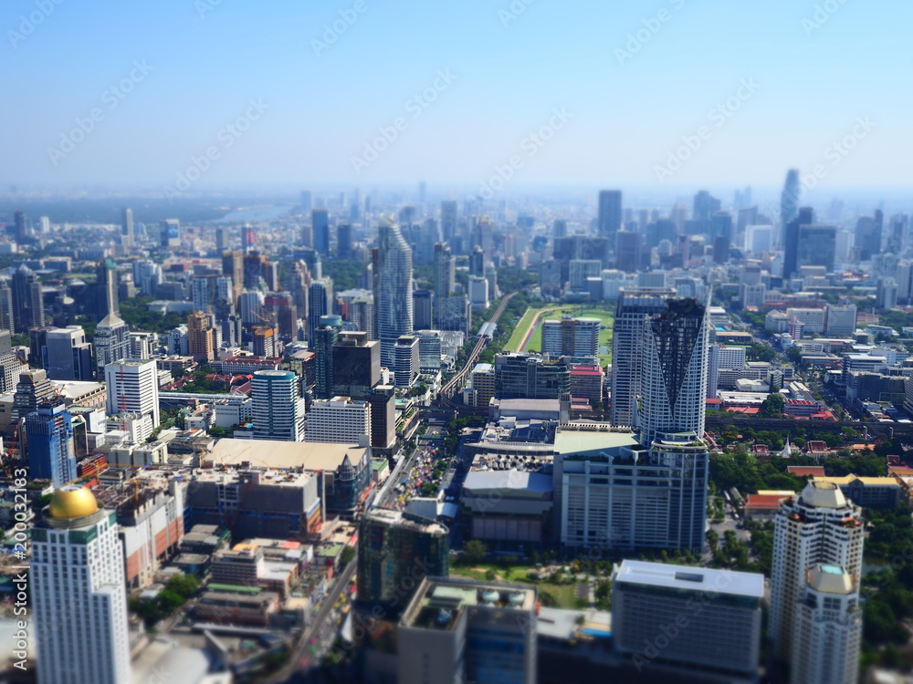 Fototapeta premium Miniature Tilt shift lens effect of modern urban architectural lanscape in Bangkok.