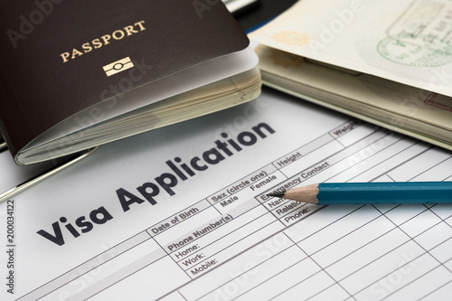 Visa application form to travel Immigration a document Money for Passport Map and travel plan photo