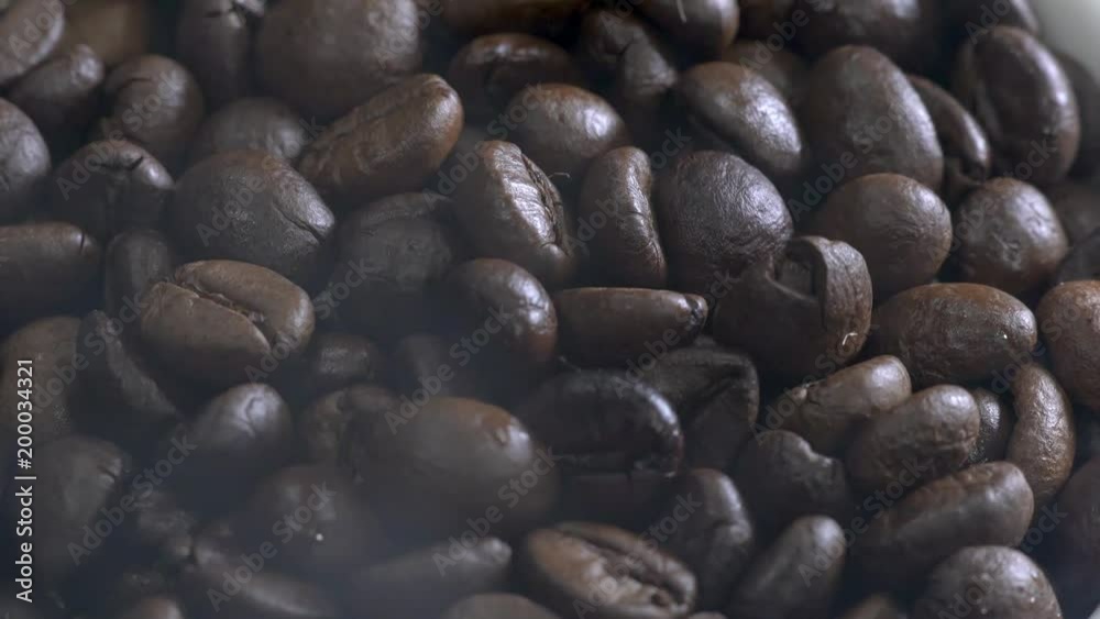 Steaming coffee beans in rotating plate Steaming coffee beans in rotating plate