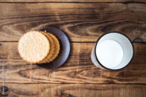 cookies and milk on wooden background