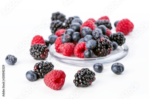 blueberries blackberries and raspberries isolated on white background