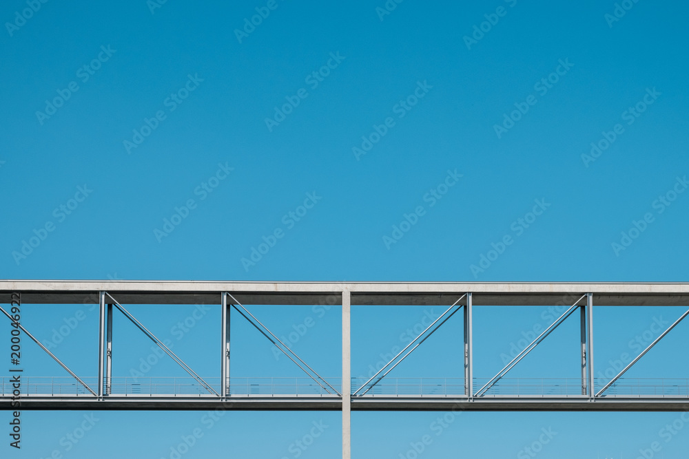 elevated pedestrian walkway / bridge on blue sky - concrete overpass elevated pedestrian walkway / bridge on blue sky - concrete overpass