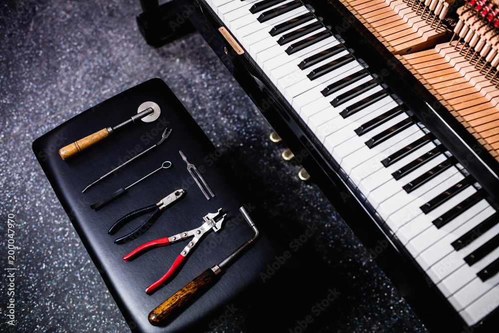 Repairing tools and on old piano keyboard Stock-Foto | Adobe Stock