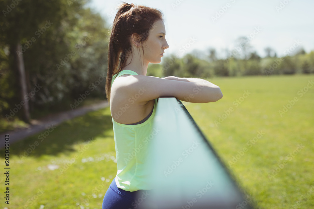 Side view of thoughtful young woman standing outdoors Side view of thoughtful young woman standing outdoors
