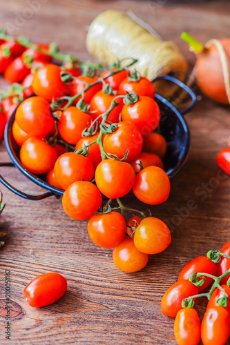 tomatoes, onions and asparaguson a wooden background photo