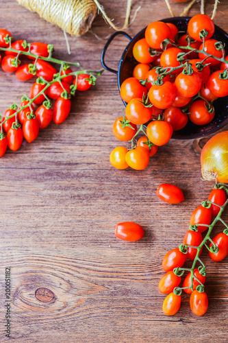 tomatoes, onions and asparaguson a wooden background photo