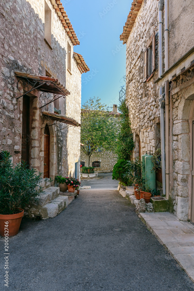 streets with flowers in the old village Gourdon, France