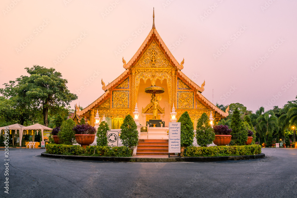 Fototapeta premium Stunning Wat Phra Singh Woramahawihan Buddhist Temple at sunrise in Chiang Mai, Thailand