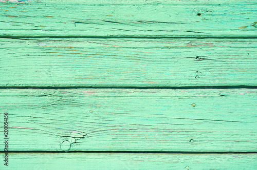 Pastel green stained wood background texture with horizontal parallel boards