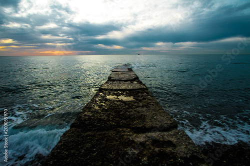  Sunset on a stone pier.